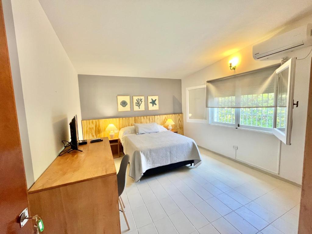 Postel nebo postele na pokoji v ubytování Je Nous Casa