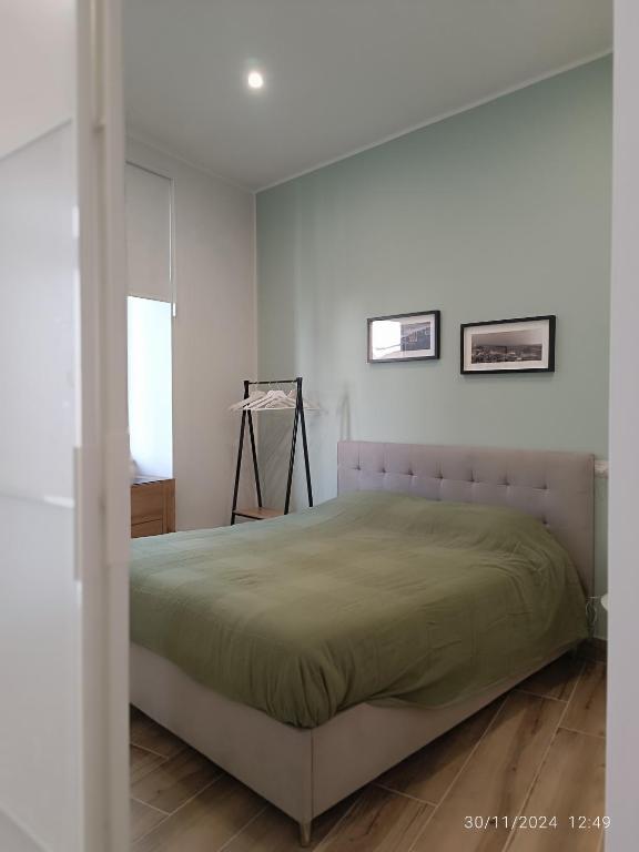 a bedroom with a bed in a white room at Villanova 48 in Naples