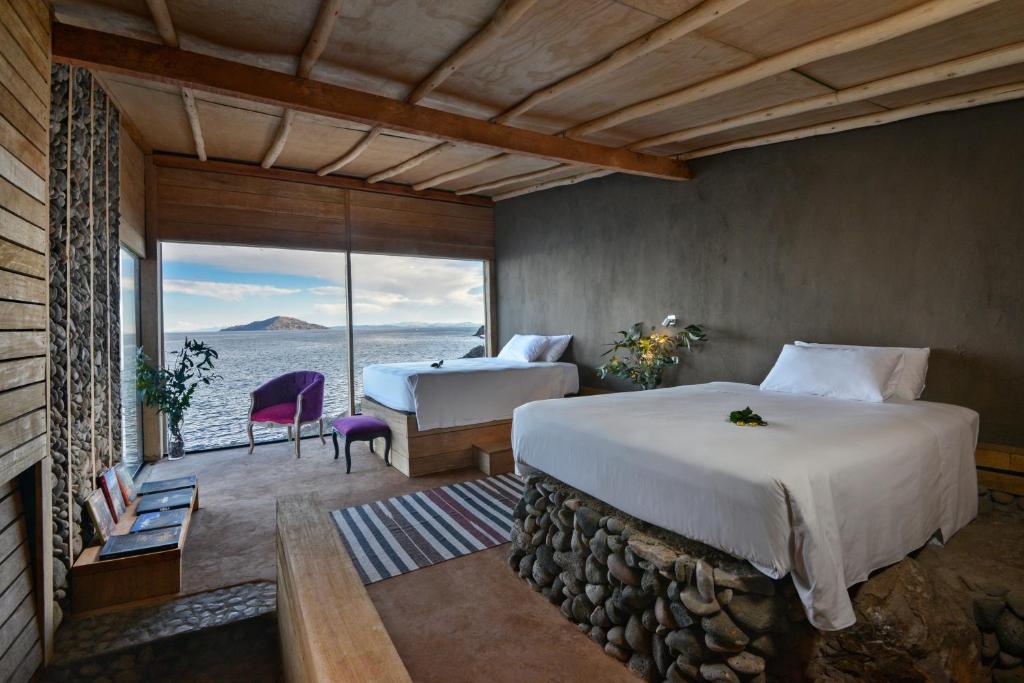 Postel nebo postele na pokoji v ubytování Amantica Lodge