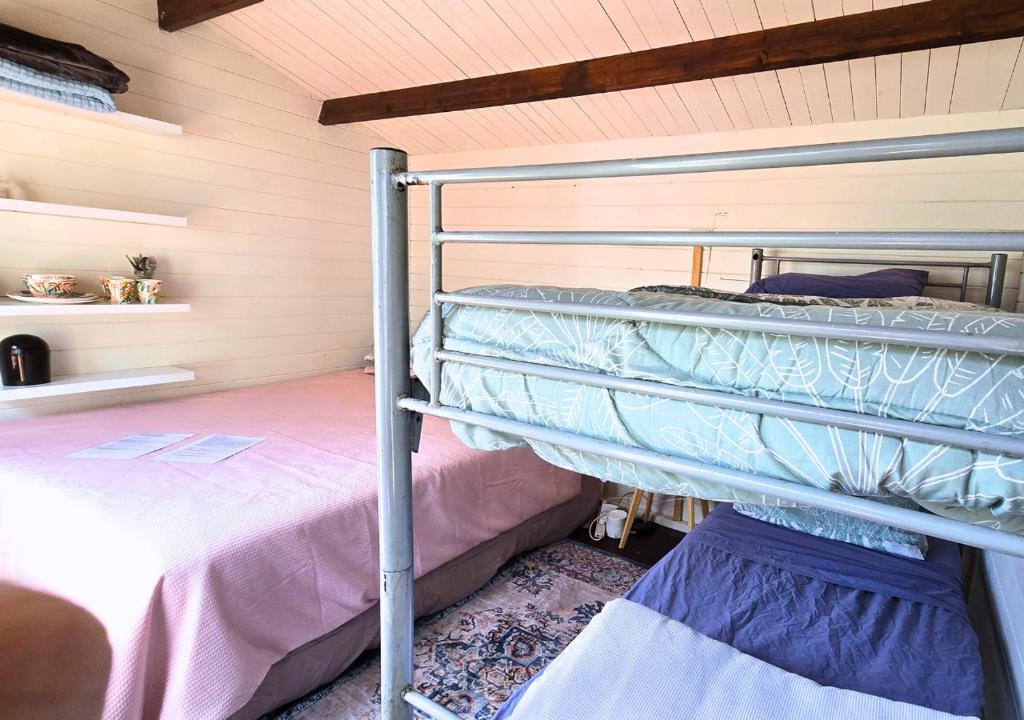 Postel nebo postele na pokoji v ubytování Tairua Garden Hideaway - Homestay with Private Room