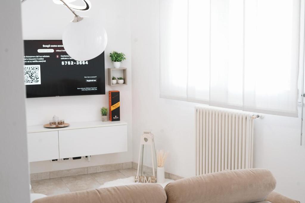 TV a/nebo společenská místnost v ubytování NSH Apart Malpensa
