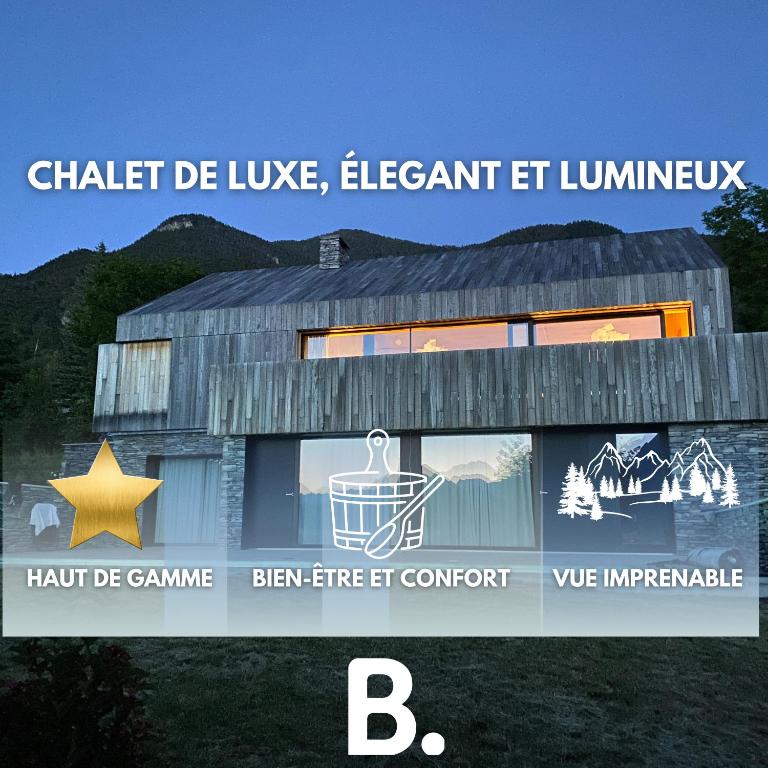 un bâtiment avec un signe indiquant que la craie est un éléphant vivant et un luminatek dans l'établissement Élégant chalet contemporain - sauna - piscine -10p, à Guillestre