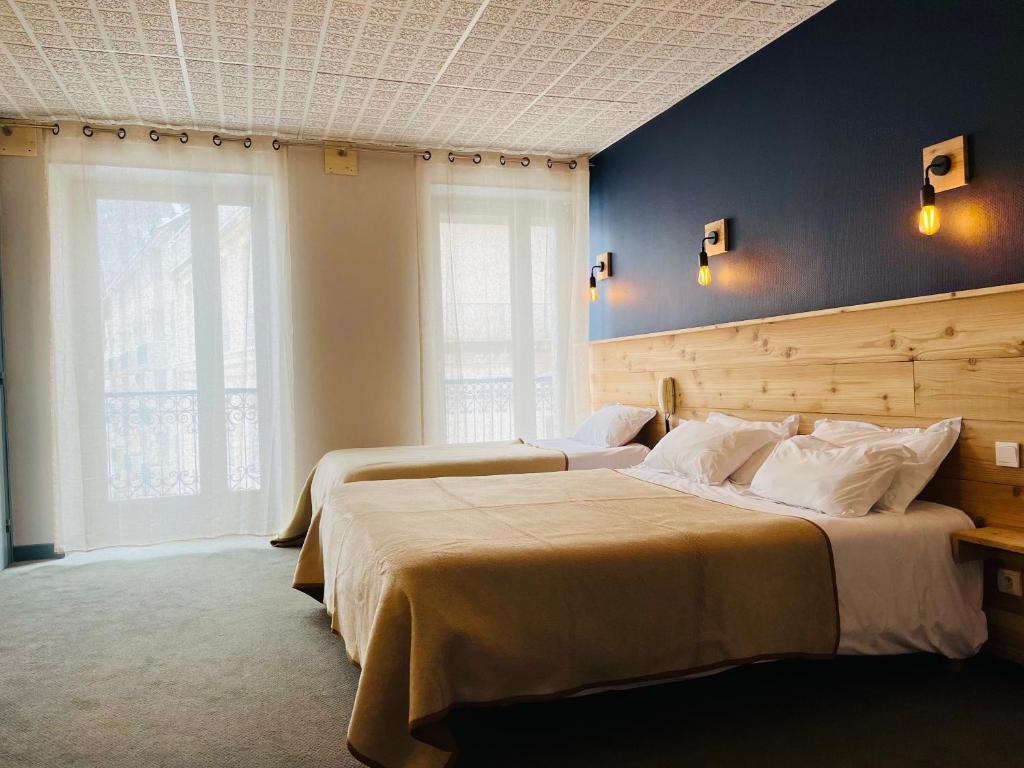 Postel nebo postele na pokoji v ubytování Hotel le Sacca, nouvelle équipe