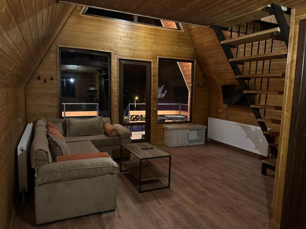 Posezení v ubytování Tuyo cottages Gudauri