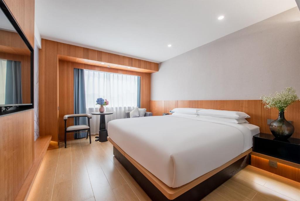 Postel nebo postele na pokoji v ubytování Fairfield by Marriott Guangzhou Tianhe Park