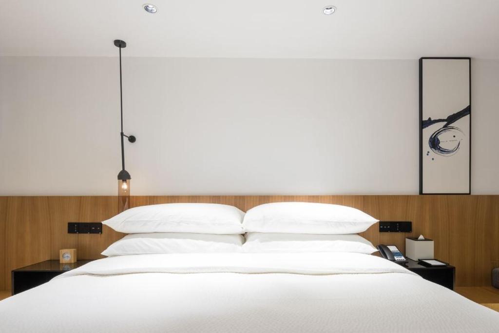 Postel nebo postele na pokoji v ubytování Fairfield by Marriott Guangzhou Tianhe Park