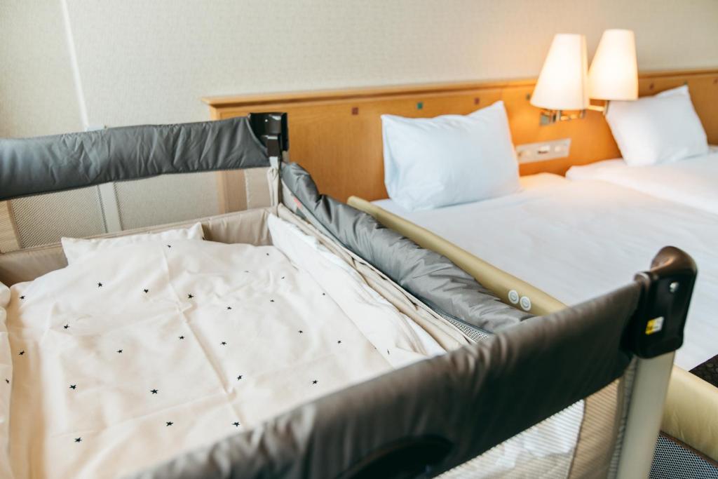Postel nebo postele na pokoji v ubytování KAMENOI HOTEL Kii-Tanabe
