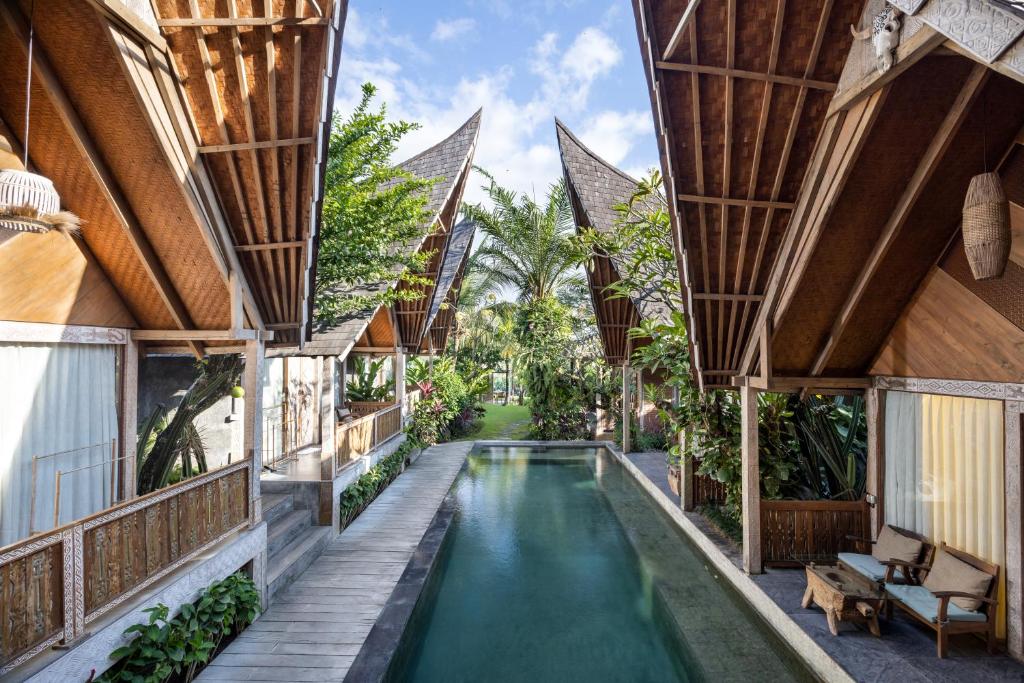 an external view of a house with a swimming pool at Premadhan Sanctuary in Canggu