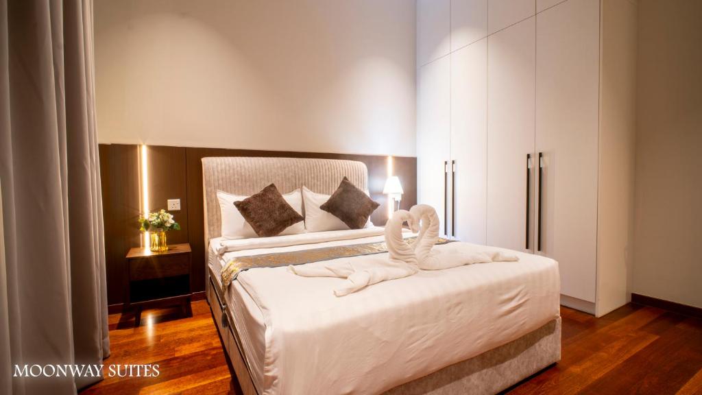 Postel nebo postele na pokoji v ubytování Moonway Luxury Suites At The Manor Residence KLCC