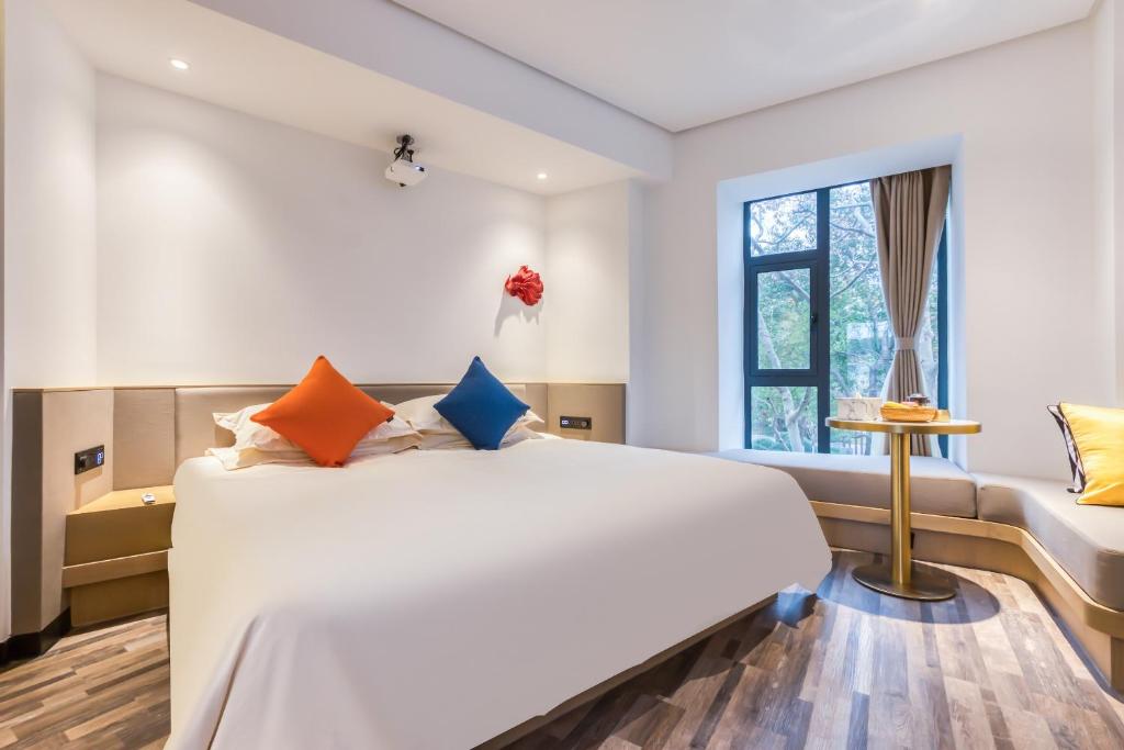 Postel nebo postele na pokoji v ubytování Cozylife Hotel Canal