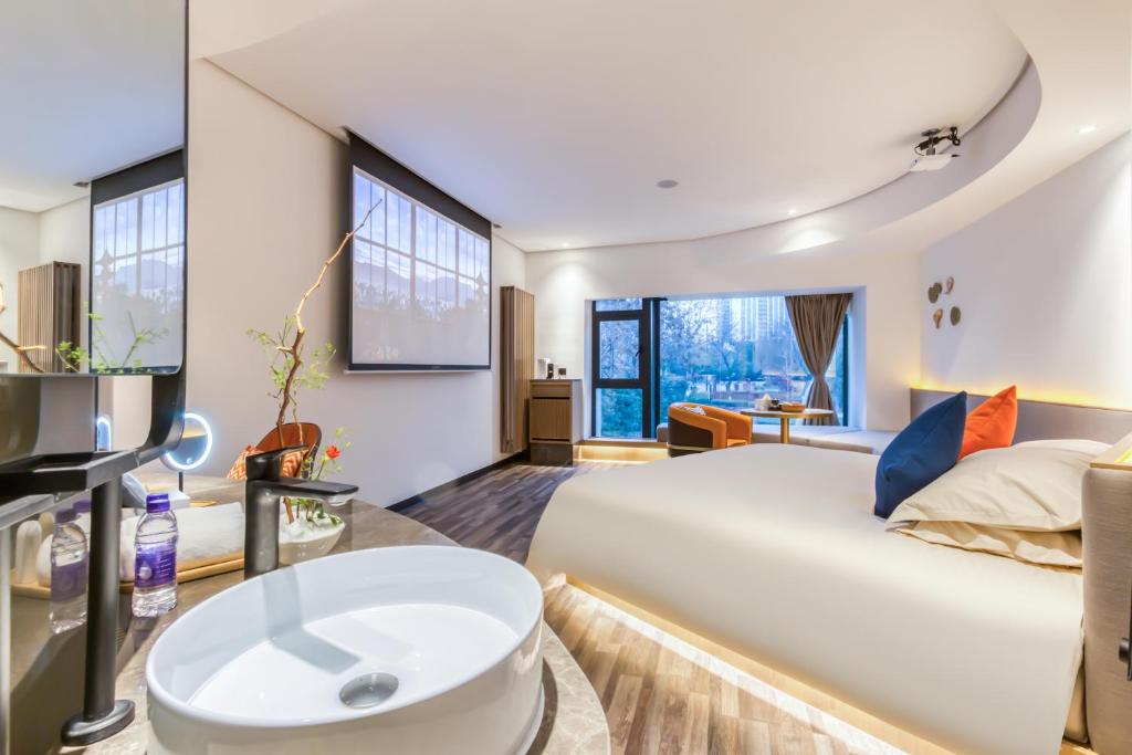 Postel nebo postele na pokoji v ubytování Cozylife Hotel Canal