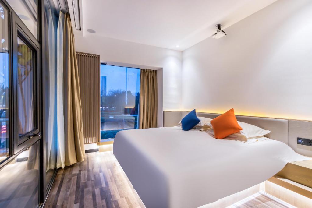 Postel nebo postele na pokoji v ubytování Cozylife Hotel Canal