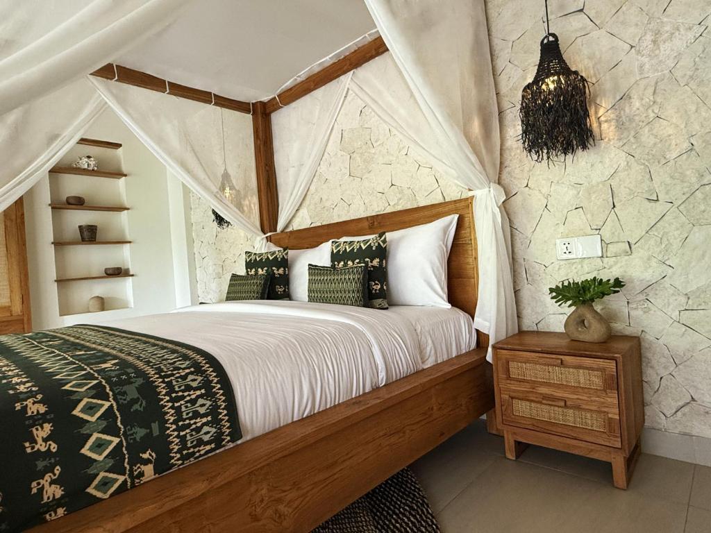 Postel nebo postele na pokoji v ubytování ARYA Sumba Resort - Kodi