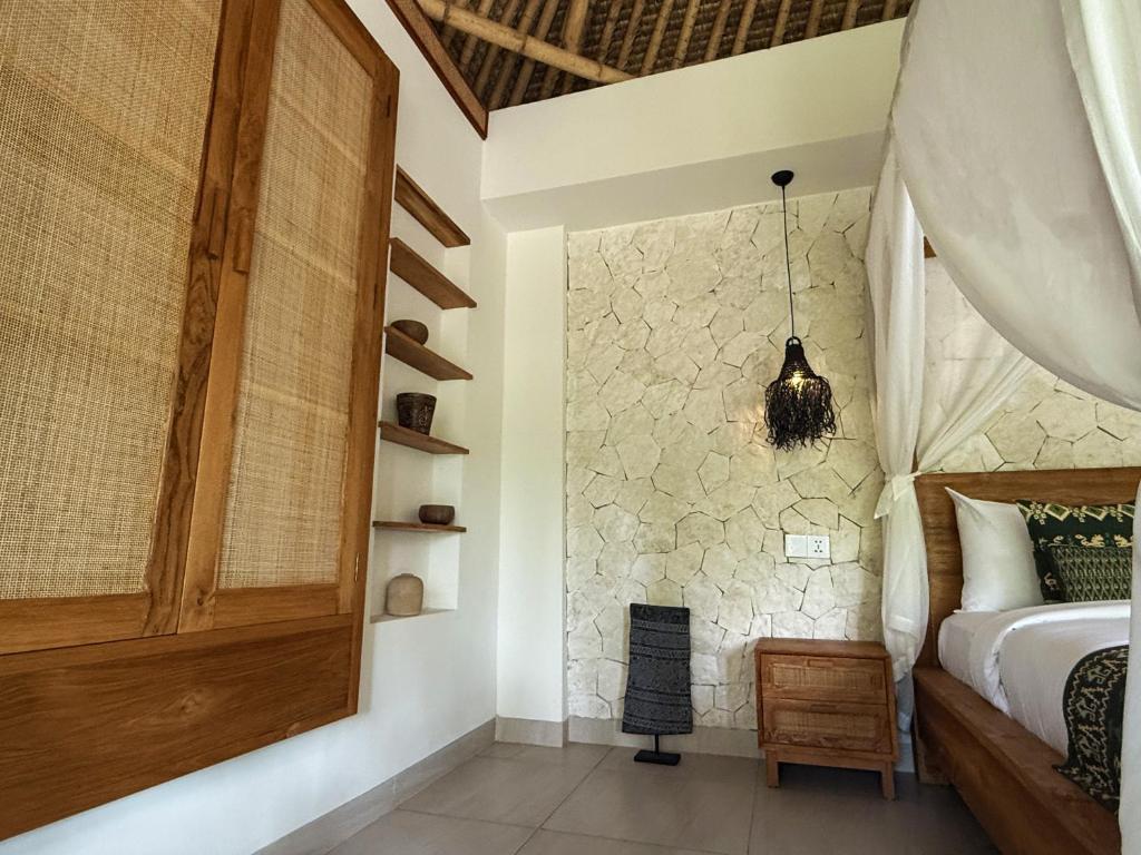 Postel nebo postele na pokoji v ubytování ARYA Sumba Resort - Kodi