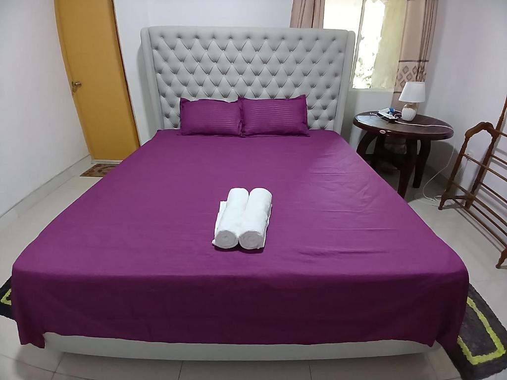 Postel nebo postele na pokoji v ubytování Laxapana Wilderness Homestay