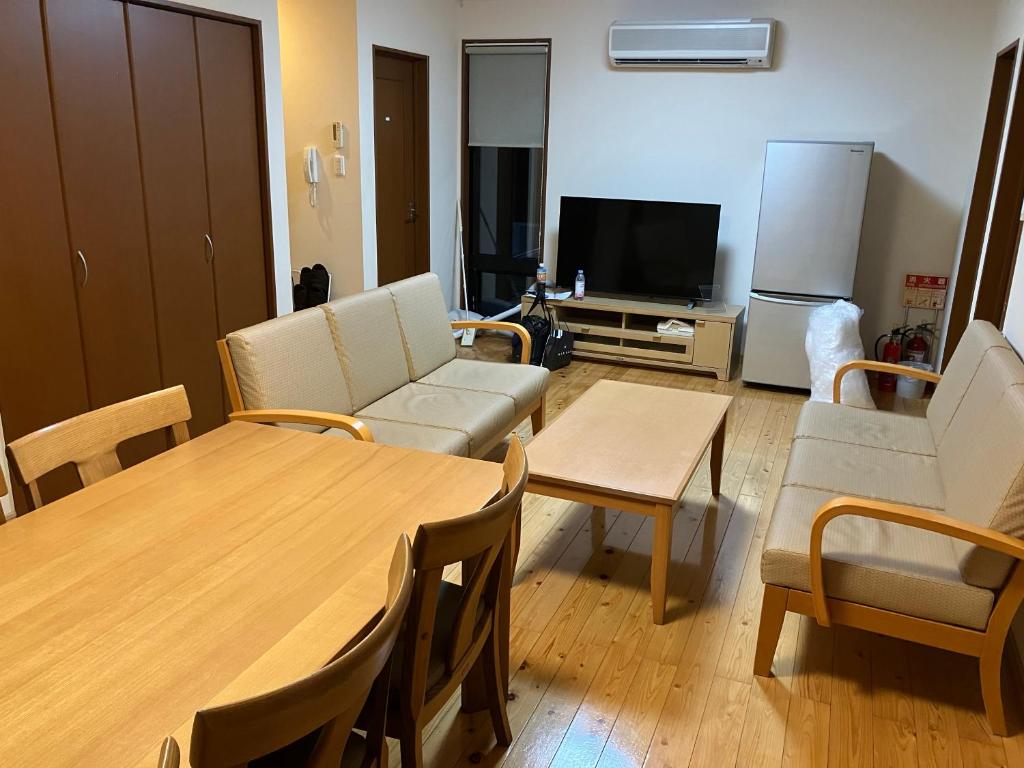 TV a/nebo společenská místnost v ubytování Yamashitako Lodge