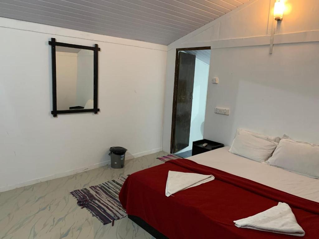 Postel nebo postele na pokoji v ubytování Casa Beach hut Resort
