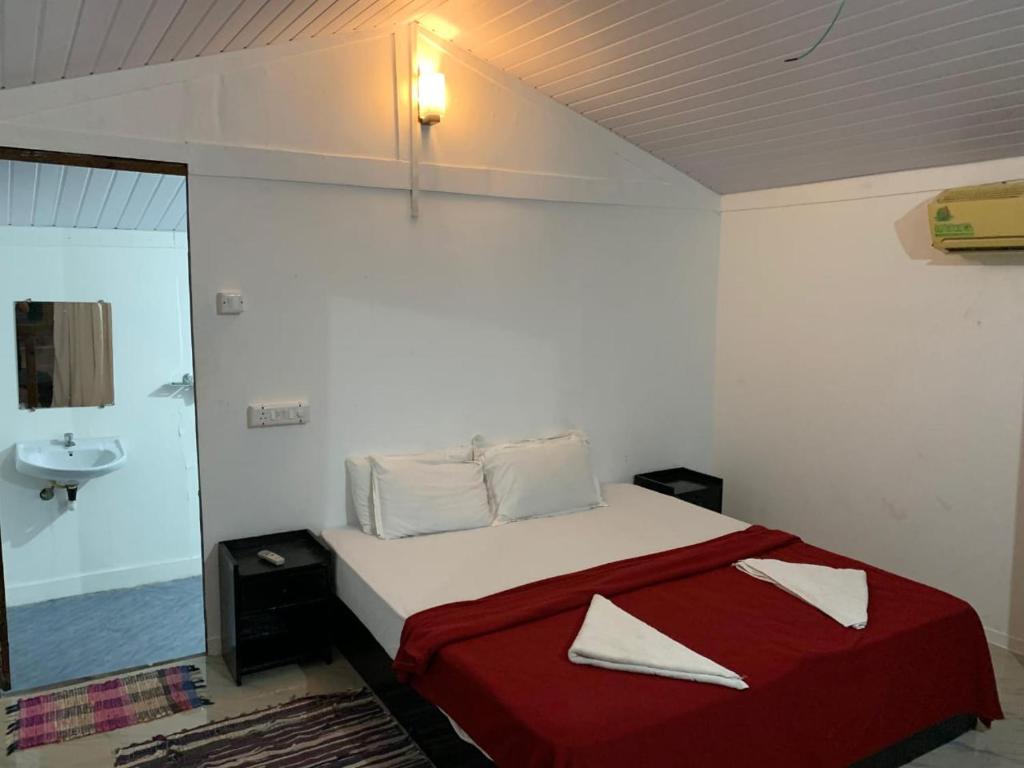 Postel nebo postele na pokoji v ubytování Casa Beach hut Resort