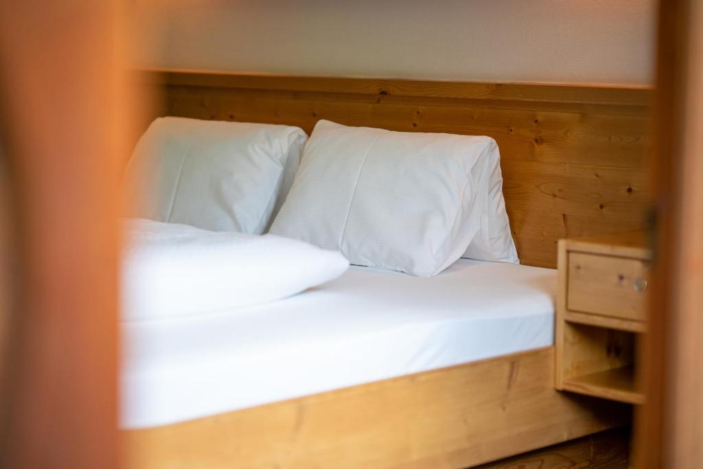 A bed or beds in a room at Ferienpension Senfter