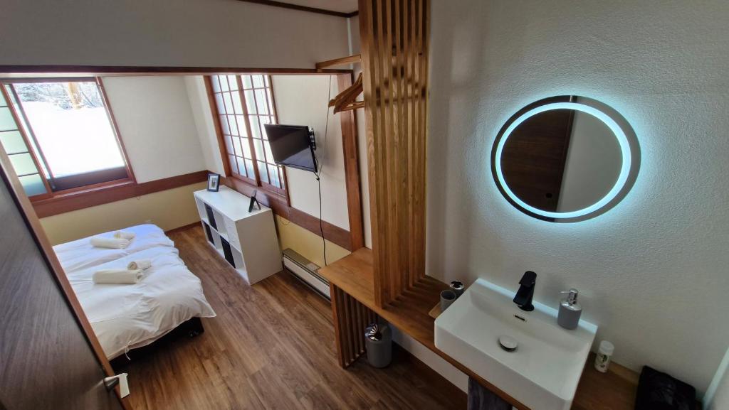 Postel nebo postele na pokoji v ubytování Kodama Lodge