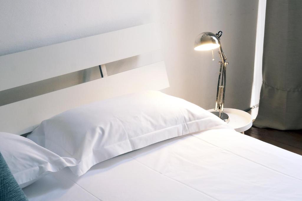A bed or beds in a room at ComeCasa 2 bedrooms Apartment in via Curtatone