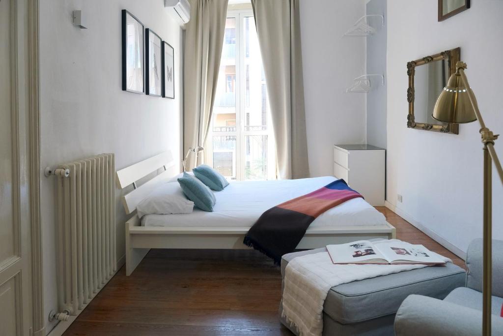 A bed or beds in a room at ComeCasa 2 bedrooms Apartment in via Curtatone
