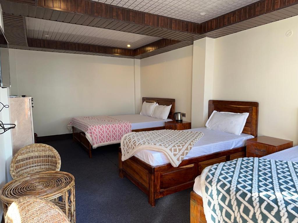 Postel nebo postele na pokoji v ubytování Hotel Basera
