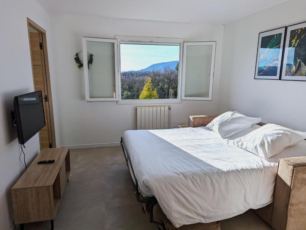Postel nebo postele na pokoji v ubytování Gîte - Chez Gabriel et Julie