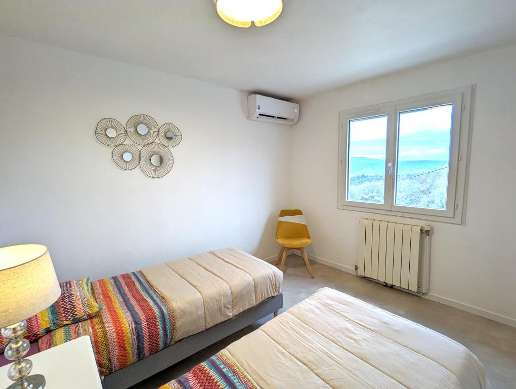 Postel nebo postele na pokoji v ubytování Gîte - Chez Gabriel et Julie