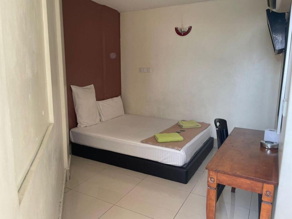 Postel nebo postele na pokoji v ubytování SV Andalas Hotel