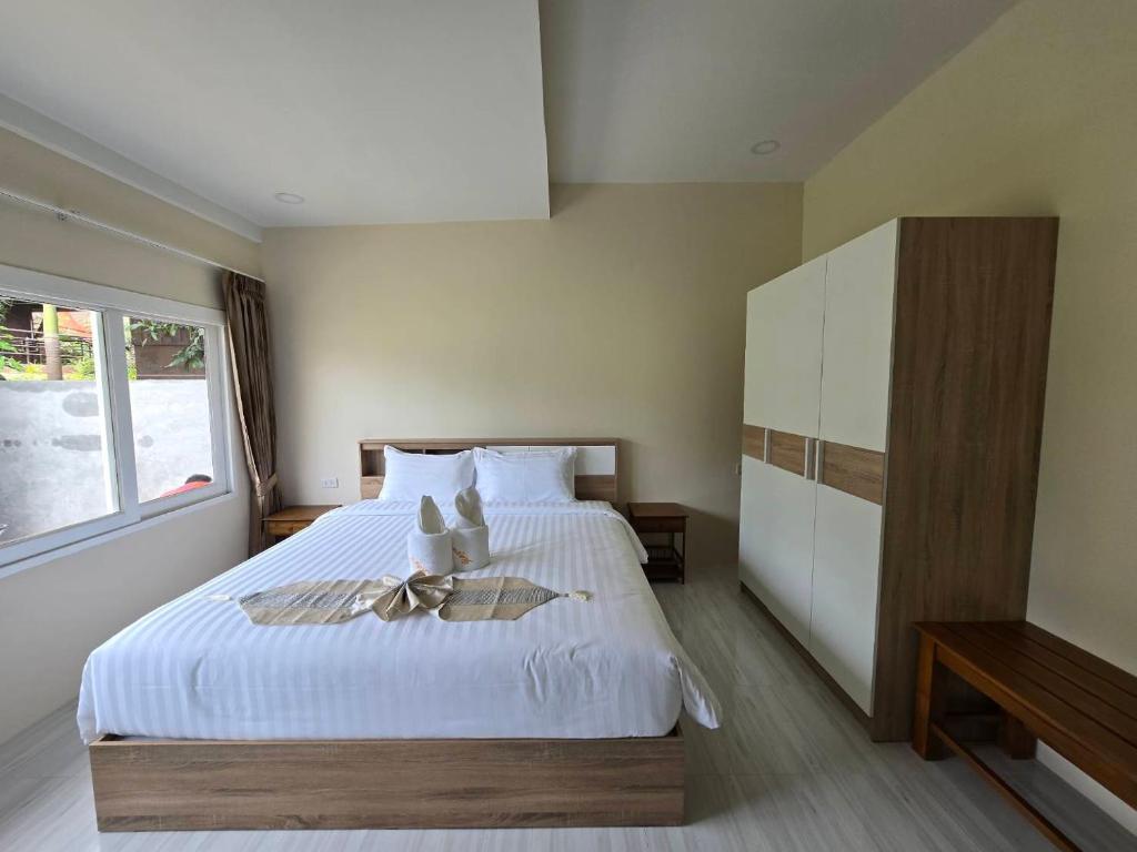 Postel nebo postele na pokoji v ubytování Natural Samui Hotel