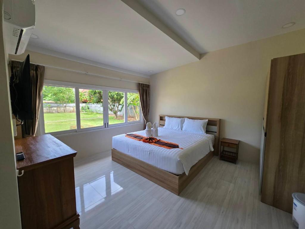 Postel nebo postele na pokoji v ubytování Natural Samui Hotel