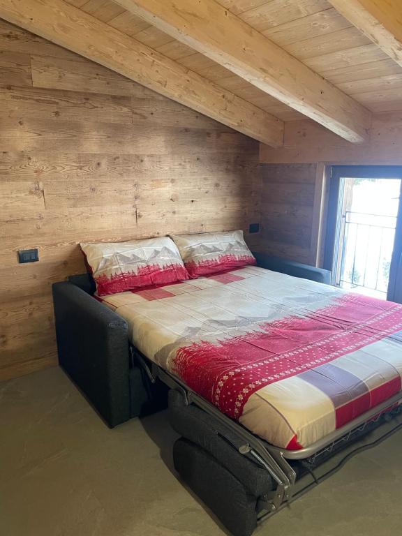 Voodi või voodid majutusasutuse Sabbionaccio Apartments & Spa toas