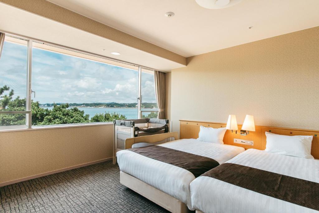 Postel nebo postele na pokoji v ubytování KAMENOI HOTEL Kii-Tanabe