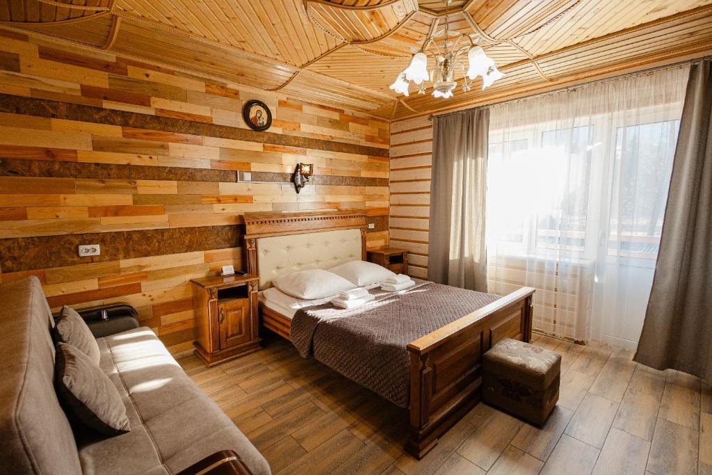 Postel nebo postele na pokoji v ubytování Zatyshok nad Prutom