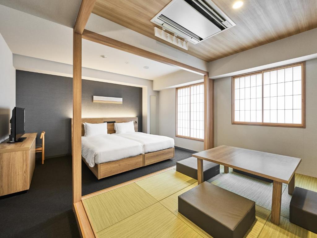 Postel nebo postele na pokoji v ubytování MIMARU Tokyo Akasaka
