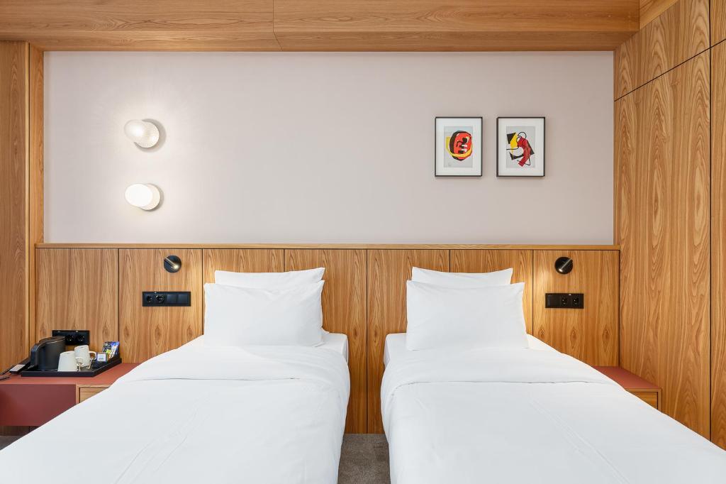 Postel nebo postele na pokoji v ubytování Aston Hotel Riga