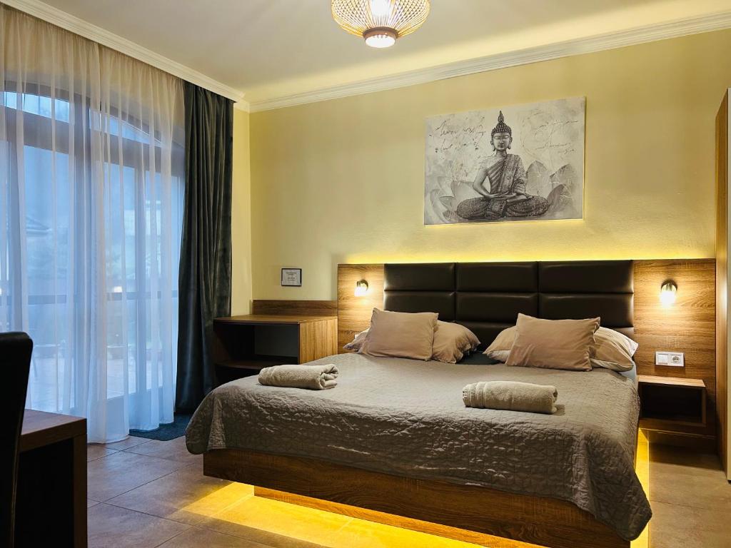 Postel nebo postele na pokoji v ubytování Harmónia Vendégház