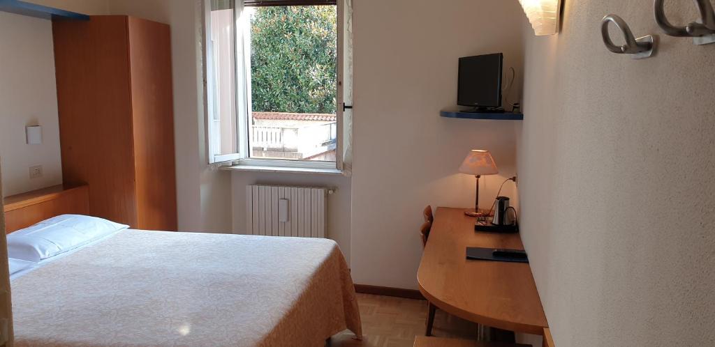 Postel nebo postele na pokoji v ubytování Hotel Tre Re
