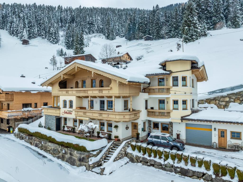 a large house with snow on the roof at Appartement Sonne im Ferienhaus Johanna - Mayrhofen-Hippach- In der Nähe von der Skipiste in Hippach