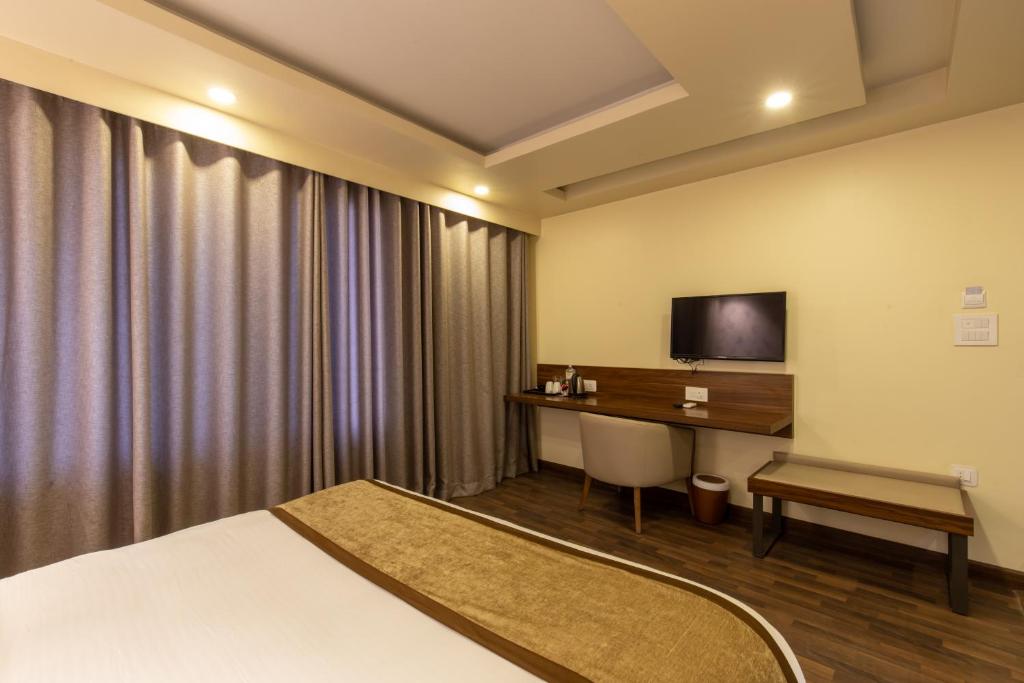 TV a/nebo společenská místnost v ubytování Gorakha Hotel