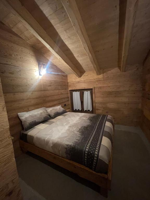 Voodi või voodid majutusasutuse Sabbionaccio Apartments & Spa toas