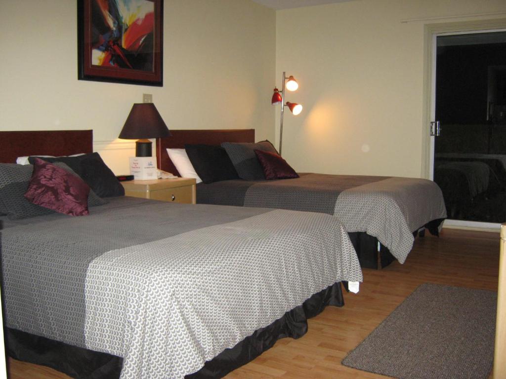 Postel nebo postele na pokoji v ubytování Slumber Lodge