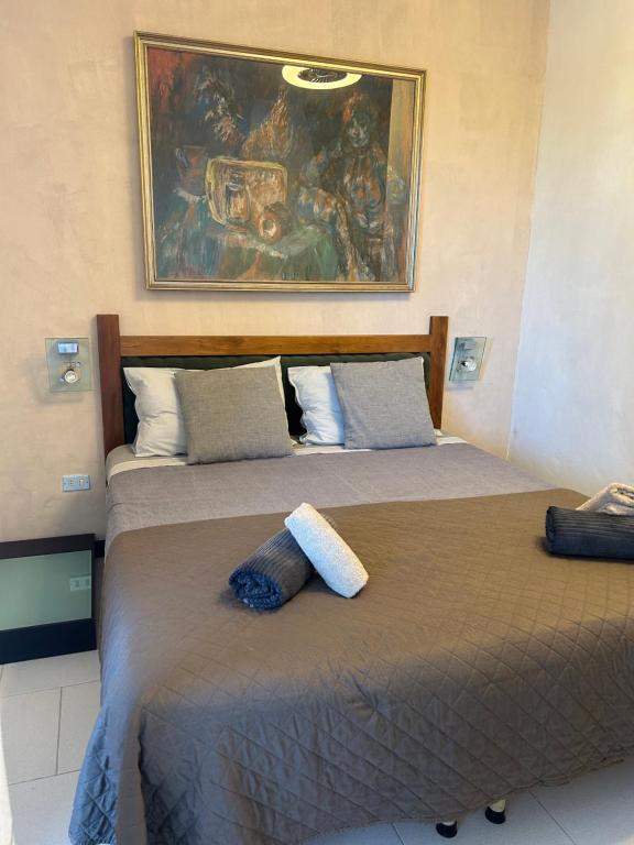 Postel nebo postele na pokoji v ubytování Salesiani rooms
