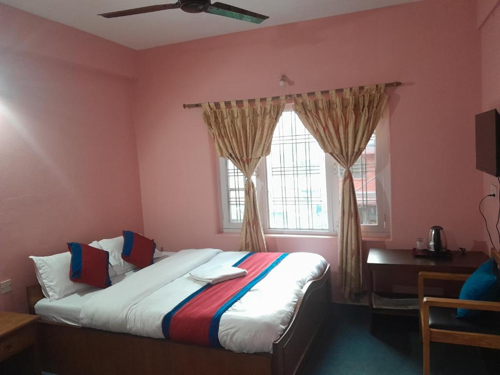 Llit o llits en una habitació de Hotel Village Inn