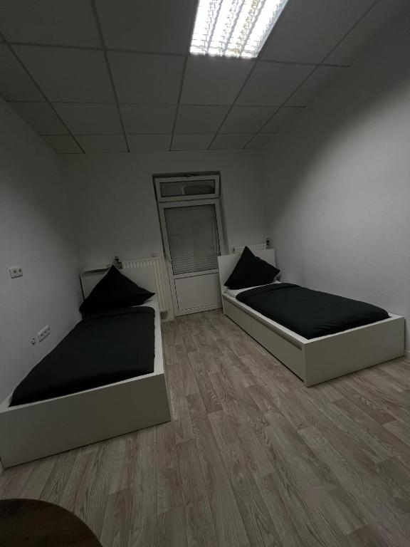 Postel nebo postele na pokoji v ubytování HH Hostels