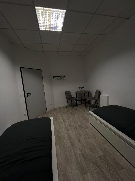 Postel nebo postele na pokoji v ubytování HH Hostels