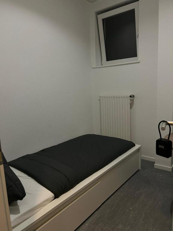 Postel nebo postele na pokoji v ubytování HH Hostels