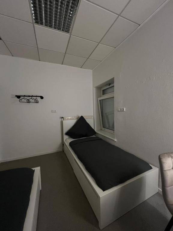 Postel nebo postele na pokoji v ubytování HH Hostels