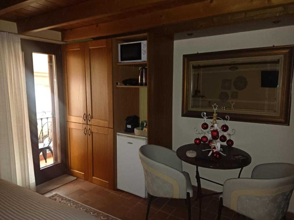 a kitchen and dining room with a table and chairs at Αρχοντικό Κορκόντζελου in Nafpaktos